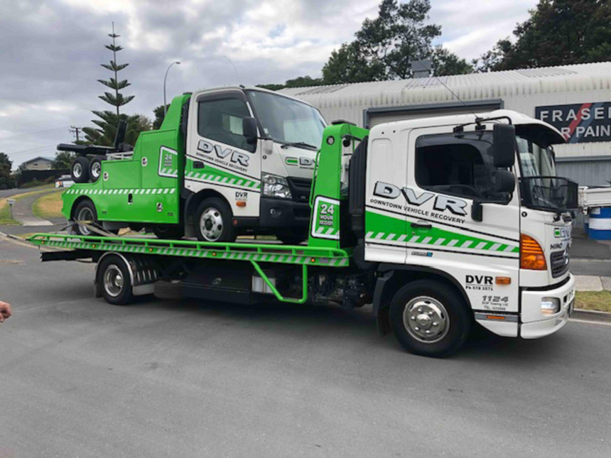 small tow truck on big tow truck