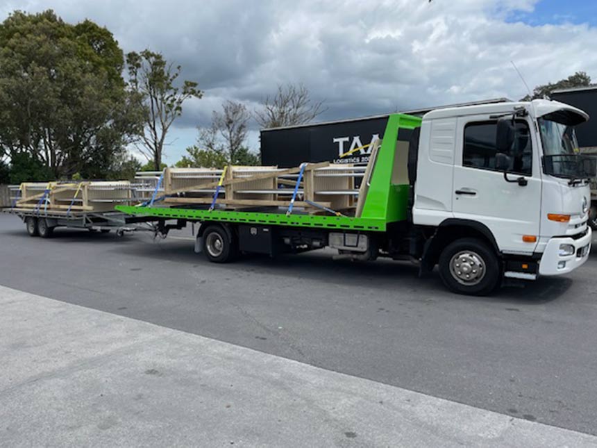 DVR-building-material machinery on tow truck